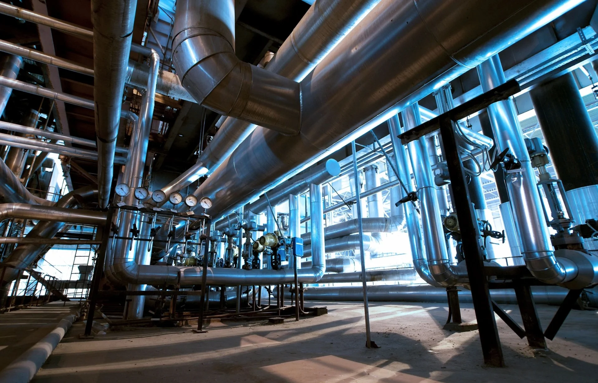 A large industrial building with pipes and valves.